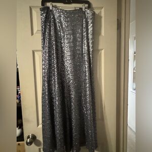 Sparkle time in sequined ankle length silver skirt.